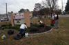 Bev Vos, director of promotional strategies, supervised a landscaping project at Pope Elementary School during Day of Remembrance. - Photo by Morris Abernathy