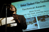 Senior Filmmaker Nic Pfost accepts the award for Best Score for his film <i>the good, the bad, and the beautiful</i> during the Third Annual Union Student Film Festival. The film also won The Students' Choice Award. - Photo by Kathleen Murray