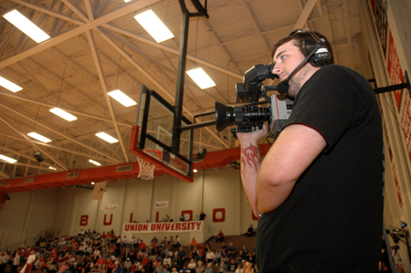 Junior Aaron Hardin of the Union Broadcasting Society mans a camera during the live broadcast of Union versus Oklahoma City University basketball.