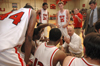 Ralph Turner, men's head basketball coach, talks to his team during a timeout from the game against Oklahoma City University. - Photo by Brad Moore