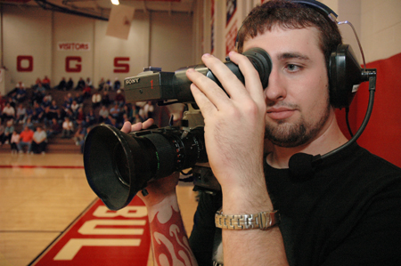 Junior Aaron Hardin of the Union Broadcasting Society mans a camera during the live broadcast of Union versus Oklahoma City University basketball.