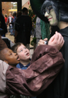 Audience members examine Kyle Raines' makeup after a performance of <i>Hansel and Gretel</i>. - Photo by Kyle Kurlick