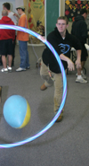 Logan Nash does something with a hula hoop during the Junior/Freshman Party. - Photo by Kyle Kurlick