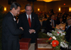 Claude Pressnell, president of the Tennessee Independent Colleges and Universities Association and former Union trustee, presents Union University President David Dockery with a 1620 copy of Augustine's <em>City of God<em> during a Dec. 1 banquet honoring Dockery for 10 years of leadership at Union.  - Photo by Morris Abernathy