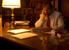 Dr. Hal Poe, Charles Colson Professor of Faith and Culture, reviews some papers in his office. - Photo by Morris Abernathy