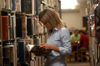 Senior Blaire Collins looks through the stacks in the Emma Waters Summar Library. - Photo by Morris Abernathy