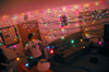 Senior Chris Hayden admires his brightly decorated dorm room during the holidays. - Photo by Brad Moore