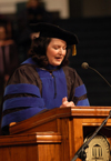 Social work professor and graduate parent Terry Blakley gives the invocation during the 2005 fall graduation ceremony. - Photo by Morris Abernathy
