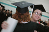 Sharon Hart hugs friend and roommate Kathleen Murray shortly before December graduation ceremonies. - Photo by Kristen Nicole Sayres