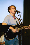 Theology major Lance Parrott leads worship during the Family Weekend Chapel.
 - Photo by Lindsay Stavish