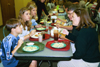 Freshman Emily Boecking enjoys a meal together with her family during Family Weekend 2002.
 - Photo by Lindsay Stavish