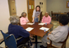 Julie Bradfield, director of student ministries, spends time with patients at Mission Convalescent Home in Jackson on Martin Luther King, Jr. Day. - Photo by Morris Abernathy