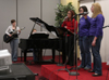 Women lead in praise and worship at the first Klemata large group meeting of the spring. - Photo by Stephanny Rodriguez