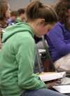 Angela White digs into the Word at the first Klemata large group meeting of the spring. - Photo by Stephanny Rodriguez