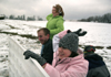 Brittany Sampson, John Henson, Sarah Eastin and Brian Burns keep the fun going during a snowball fight near the U. - Photo by Kyle Kurlick