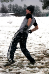 Drew Winter evades incoming snowballs during a snowball fight. - Photo by Kyle Kurlick