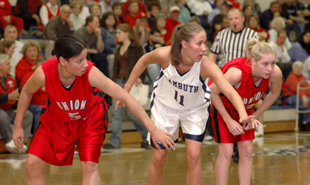 Tiffany Fisher (5) and Crystal Eason (3) block out during a free throw attempt in a game versus Lambuth.