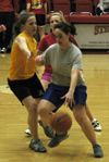 Independent Kathryn Kiper drives with the ball in an intramural basketball game against Chi Omega. - Photo by Stephanny Rodriguez