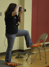 Mallory McHendry focuses on her subject while others focus on her feet. - Photo by Stephanny Rodriguez