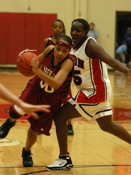 D.J. Sissoko tries to stop the Cumberland player from driving to the basket. 