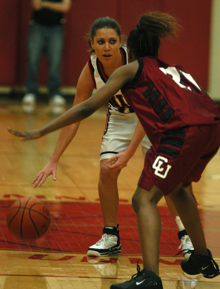 Jennifer Henson handles the ball while being guarded by a Cumberland player. 