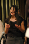 Sarah Santiago-Bullington sings with the gospel choir during chapel. - Photo by Brad Moore