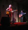 Sandra McCracken performs at the Homecoming Coffeehouse while husband Derek Webb tunes his guitar before joining her. - Photo by Brad Moore