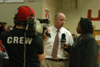 UBS Reporter Tosheia Cole with Wes Calvert on camera interviews Coach Turner following the Homecoming game against Mountain State. - Photo by Heather Phillips