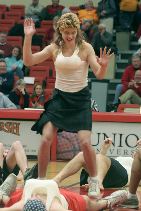 Jeff Norris performs as a cheerleader at the homecoming game with the rest of the men of SAE.