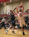 Junior Ben Frederick (54) gets fouled as he goes up for a shot in a game versus Mountain State.  - Photo by Kyle Kurlick