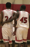Deywane Lee (24) and Corey Burkett (45) huddle up with teammates during a home game at The Fred.
 - Photo by Kyle Kurlick