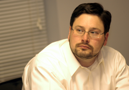 MBA student Curtis Watson focuses on the lecture during a class on the Germantown campus.