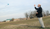 Dr. Richard Joiner, chair of the music department,  joins in the fun of flying kites. - Photo by Kyle Kurlick