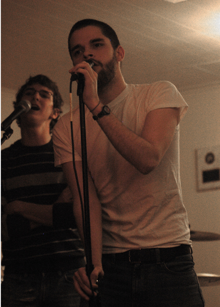 Aaron Shepherd and Bryan Robison sing with their student band <em>Uncollected Prose</em>.