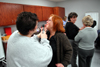 Instructors Kat Cooper and Pat Keene (background) facilitate a medical exam class for the RN-BSN program on the Germantown campus. - Photo by Morris Abernathy