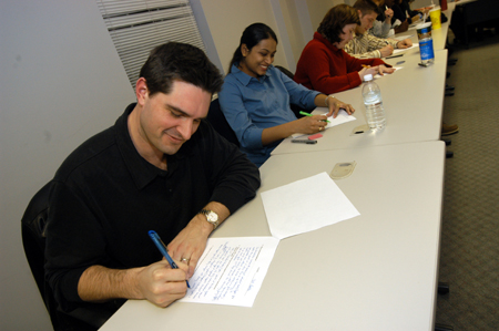 Members of Michael Stewart's MIS MBA class on the Germantown campus take a test.