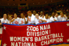 Once again, Union's Lady Bulldogs pose with a national championship banner at Oman Arena. The 2006 title marks the second consecutive year Union has emerged from the 32-team tournament as the No. 1. - Photo by Morris Abernathy