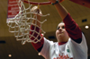 Student assistant Joanna Vaughan helps cut down the nets after Union's 79-62 victory over Lubbock Christian. The Lady Bulldogs secured their second consecutive NAIA national championship with the win. - Photo by Jim Veneman