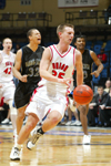 Matt Trammell turns back up the floor after as steal in Union's first round game in the NAIA National Tournament. - Photo by Uncredited