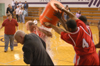 Chris Williams (4) and Corey Burkett (45) douse Union head coach Ralph Turner with the remaining contents of the water cooler following Union's second straight TranSouth Tournament Title.  Union's TV Broadcaster Steve Beverly gets caught in the mix. - Photo by Steven Aldridge