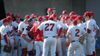 The Bulldogs huddle between innings. - Photo by Steven Aldridge