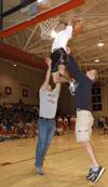 Some of the student dunkers needed a little help from their friends during the slam dunk competition at Midnight Madness. - Photo by Jim Veneman