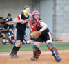 Union catcher Kylie Sullivan fields a bunt and prepars to throw down to first base.  Jackie Cliff (12) looks on from behind the play. - Photo by Steven Aldridge