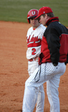 Senior outfielder Jeffrey Jackson talks with Union assistant coach Brian Pepper at first base. - Photo by Steven Aldridge