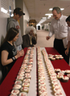 Students celebrated Einstien's birthday and Pi Day by handing out cupcakes displaying multiple digits of pi and by having an Einstein look-a-like contest. Jim Kirk, computer science professor, went for one of the lower numbers. - Photo by Heather Phillips