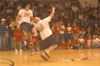 John Reed knocks Jonathan Blair down as part of the Onions crazy fan competition performance during Midnight Madness. - Photo by Jim Veneman