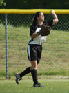 Senior centerfielder Holly Haycraft throws the ball back in to the infield after chasing down a flyball. - Photo by Steven Aldridge