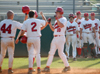 Sophomore Judson Powers (10) gets congratulated at home plate following a homerun.  Jeffery Jackson (2) and Zach Lowery (44) scored on the homerun. - Photo by Steven Aldridge