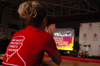 Union student trainer Ashley Oldham reacts to the video highlighting Union's 2006 NAIA National Championship at a celebration honoring the Lady Bulldogs. - Photo by Kristen Nicole Sayres