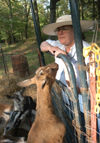 Dr. Marlyn Newhouse, associate professor of chemistry, enjoys spending time taking care of her
goats and rabbits. She owns a 50-acre farm in Medina, Tenn. complete with Russian hamsters. - Photo by Heather Phillips